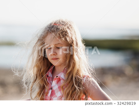 Little blonde child girl walking in summer beach Little blonde child girl walking in summer beach 32429819