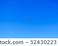 Paratroopers descend to earth on blue clear sky 32430223