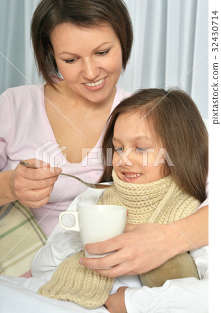 Mother taking care of daughter 32430714