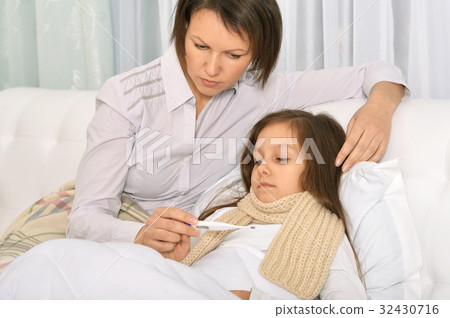 Mother taking care of daughter 32430716