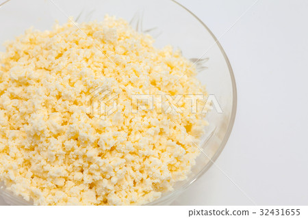 Transparent bowl filled with shredded cheese Transparent bowl filled with shredded cheese 32431655