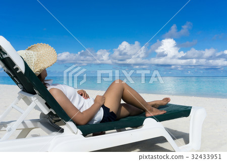 Woman in relaxation on tropical beach Woman in relaxation on tropical beach 32433951