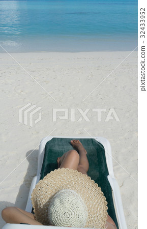 Woman in relaxation on tropical beach Woman in relaxation on tropical beach 32433952