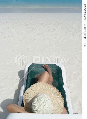 Woman in relaxation on tropical beach Woman in relaxation on tropical beach 32433953
