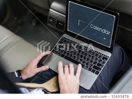 People using laptop with clock and time icon 32435878