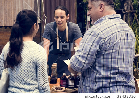 Man Selling Coffee Fresh Brew to People at Market 32438336