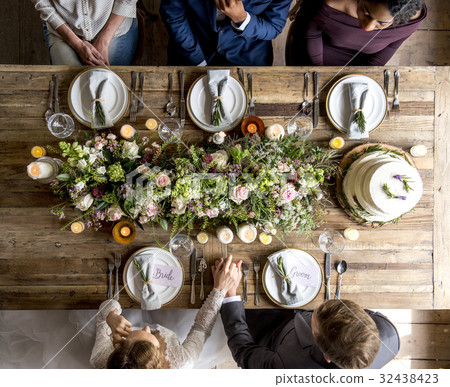 Bride and groom celebrate wedding ceremony with guests Bride and groom celebrate wedding ceremony with guests 32438423