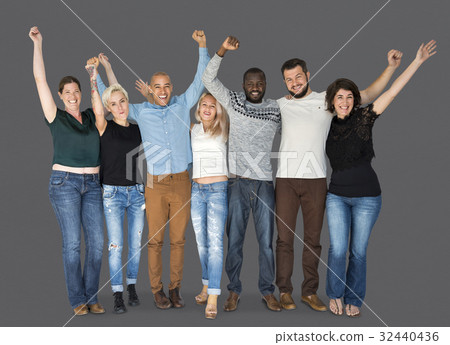 Happiness group of people huddle and arms raised smiling together Happiness group of people huddle and arms raised smiling together 32440436