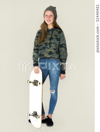Young student girl standing with skateboard Young student girl standing with skateboard 32440481