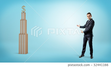 A large businessman showing a business building 32441166