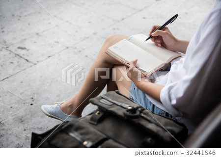 woman writing notes in diary. woman writing notes in diary. 32441546