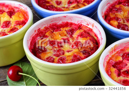 portions of Cherry clafouti in ceramic ramekins portions of Cherry clafouti in ceramic ramekins 32441856