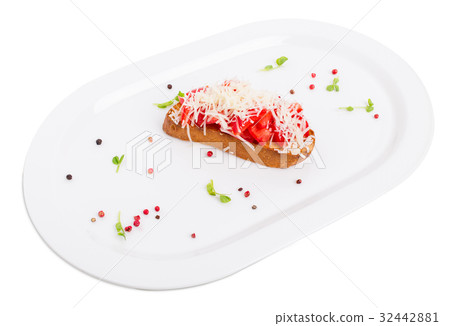 Bruschetta with tomatoes and grated parmesan. 32442881