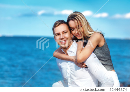 Happy couple on sea have fun on beach Happy couple on sea have fun on beach 32444874