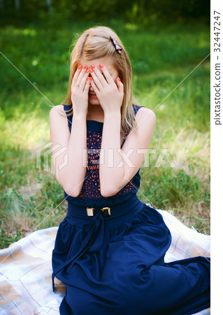 girl covered her eyes with her hands girl covered her eyes with her hands 32447247