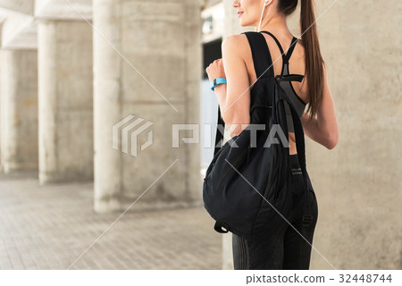 Joyful fit young woman having rest after sport 32448744