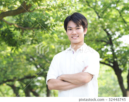 A man laughing with her arms folded A man laughing with her arms folded 32448745