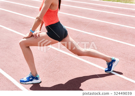 Professional jogger doing warm-up on stadium Professional jogger doing warm-up on stadium 32449039
