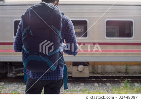 man traveler with backpacker at trainstation 32449087