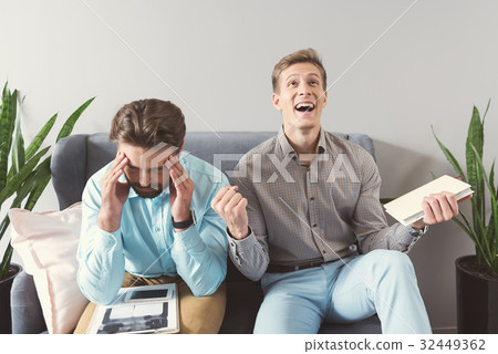 Sad and jolly candidates receiving results of job Sad and jolly candidates receiving results of job 32449362