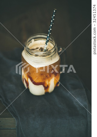 Iced caramel macciato coffee with milk in glass 32451374
