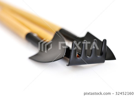 A set of garden tools for plant care on white 32452160