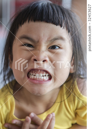 funny face of asian children grin ,toothy face 32453627