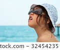 girl enjoys vacation on the sea coast 32454235