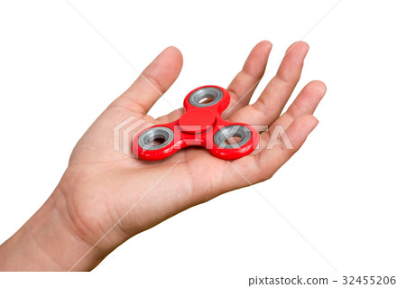 Red hand spinner. Boy playing a popular toy fidget 32455206