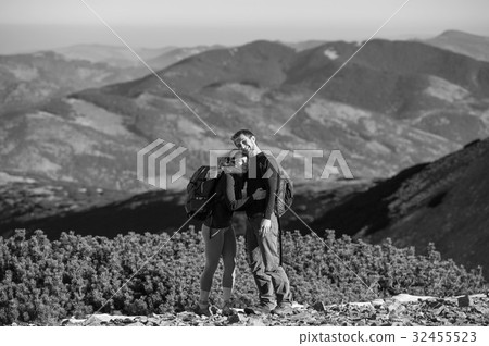 Happy couple backpackers enjoying hike on vacation 32455523