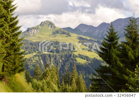 View of a valley and green hills View of a valley and green hills 32456047