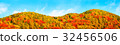 Mountains of autumn leaves and blue sky 32456506