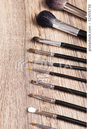 Professional make-up brushes on wooden background Professional make-up brushes on wooden background 32459736