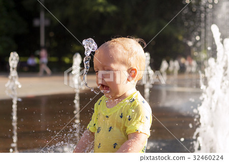 Cute toddler with funny face emotions playiong Cute toddler with funny face emotions playiong 32460224