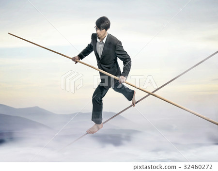 Conceptual picture of a businessman - slackliner 32460272