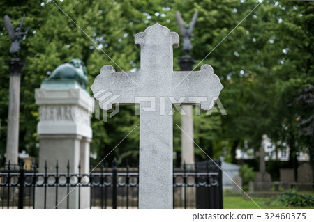 Stone cross gravestones on cemetery - graveyard Stone cross gravestones on cemetery - graveyard 32460375