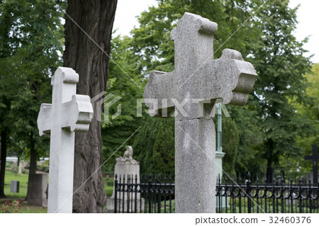 Stone cross gravestones on cemetery - graveyard Stone cross gravestones on cemetery - graveyard 32460376