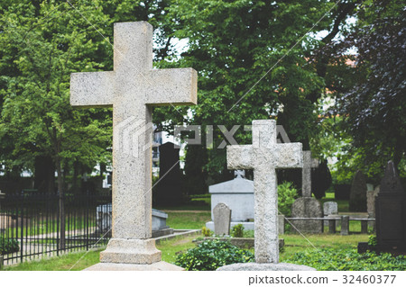 Stone cross gravestones on cemetery - graveyard Stone cross gravestones on cemetery - graveyard 32460377
