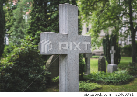 Stone cross gravestones on cemetery - graveyard Stone cross gravestones on cemetery - graveyard 32460381