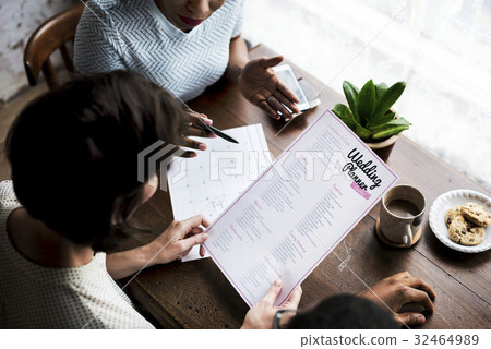 Hands Holding Wedding Planner Checklist Information Preparation Hands Holding Wedding Planner Checklist Information Preparation 32464989