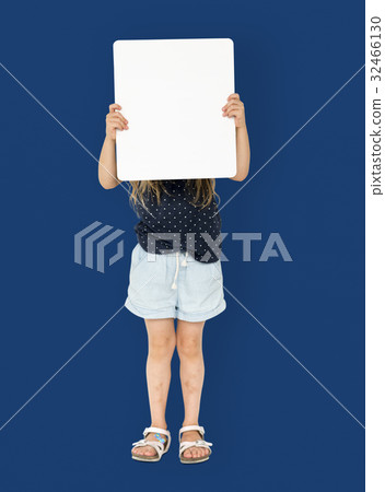 Little girl smiling and holding blank placard cover her face 32466130