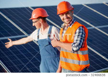 Foreman and employee at solar energy station. Foreman and employee at solar energy station. 32466636