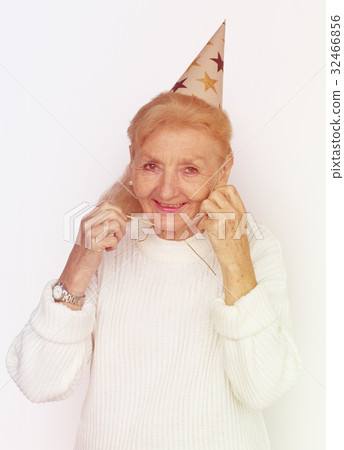 Senior Woman Wearing Party Hat Celebration Studio Portriat 32466856