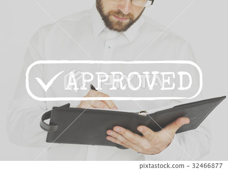 Businessman working and writing with approved word 32466877