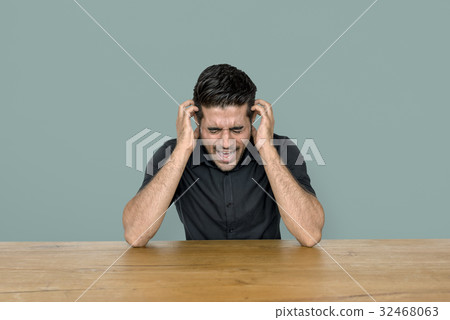 Stress man is sitting at wooden table Stress man is sitting at wooden table 32468063