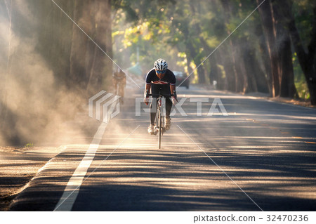 Asian man is cycling on the nature road bike  32470236