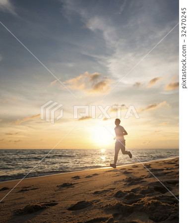 Healthy running runner man during sunset on beach Healthy running runner man during sunset on beach 32470245