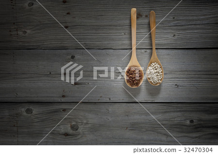 chinese pepper and white pepper on wooden spoons chinese pepper and white pepper on wooden spoons 32470304
