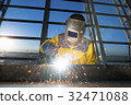Worker welding metal piping construction welder 32471088