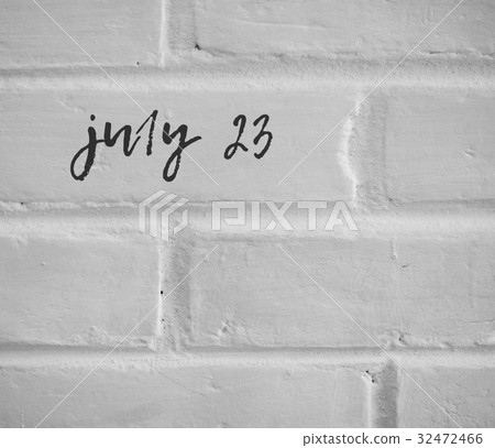 july 23 WRITTEN ON WHITE PLAIN BRICK WALL 32472466
